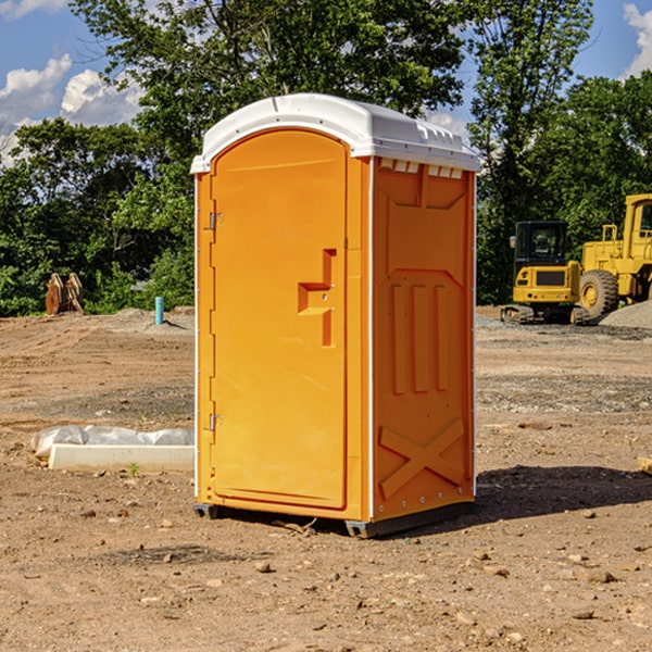 what is the cost difference between standard and deluxe portable restroom rentals in Aurora Texas